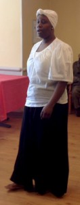 Oak Trace volunteer Wyteria Coleman leads the residents and staff members in singing several songs.