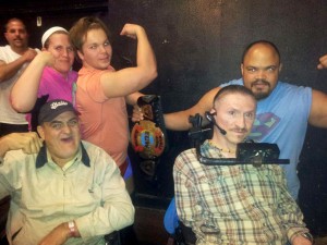 Cottage of the Shoals residents George Carroll, left, and John Benson, right, flex their muscles along with the the stars of New Generation Wrestling.