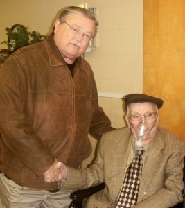 Rep. Dan Williams congratulates Otis Kennemer on receiving the Southern Cross from the Daughters of the Confederacy.