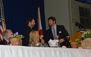 2014 Andalusia Area Chamber of Commerce President Chris Mohon, left, congratulates Stallion Sasser on being elected the chamber's 2015 president.