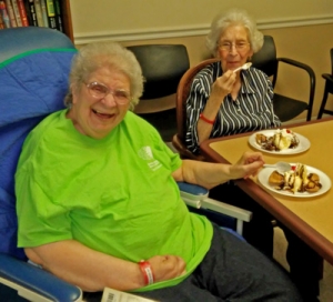 Cottage of the Shoals resident Ouida Starkey, left, and her sister enjoy the sopapillas. 