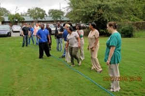 One of the tug of war teams receives instructions before picking up the rope at Crowne Health Care of Montgomery's "Rope of Hope Day."