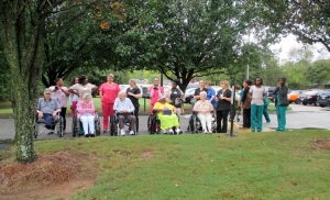 Crowne Health Care of Montgomery staff and residents line up to watch the tug-of-war competition at the "Rope of Hope Day."