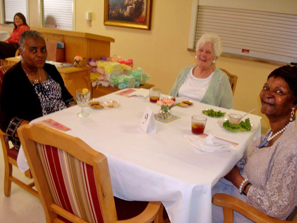 From left to right: Orchard Rehab & HealthCare residents Frances Spruill, Ruth Hicks and Doris Miles enjoy the Mother's Day Tea.