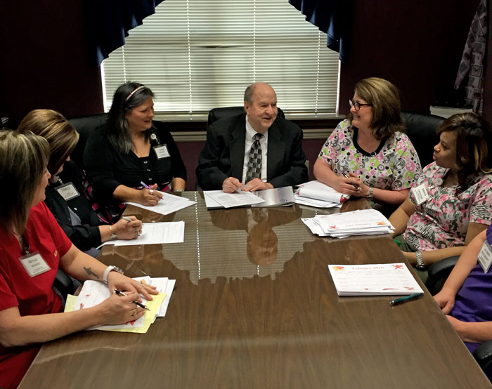 Heritage Health Care & Rehab Administrator George Jackson holds a staff meeting with the center's department heads.