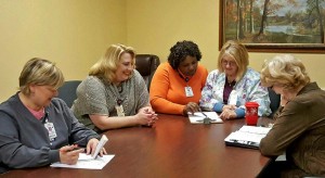 One of the daily department head meetings at Oak Park Nursing Home. From left to right: Assistant Director of Nursing Christy McDaniel, RN; Social Service Director Tracy Jenkins; Director of Nursing Amy Roberts, RN; MDS & Care Plan Coordinator LaGail Hodges, RN; and Business Office Manager Bonnie Carmack.