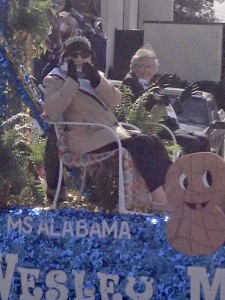 Ms. Alabama Nursing Home Sylvia Holland, left, waves to the crowd will riding in the National Peanut Festival Parade in Dothan.