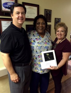 From left to right: American Health Corp. COO Laurence Baird, Oak Trace Housekeeping Director Martha Parham and Oak Trace Administrator Trina Vines.