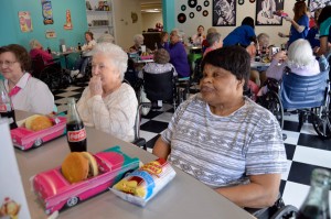 Residents of Bibb Medical Center Nursing Home enjoy lunch in the 50s Diner.