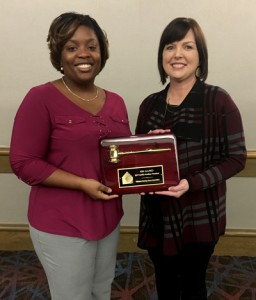 2018 President Endya Gibbs presents a plaque to 2017 President Kim Allred at the Activity & Social Service Auxiliary Annual Meeting.